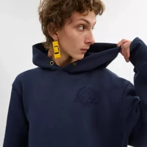 Chandail à capuchon surdimensionné avec écusson signature en coton biologique